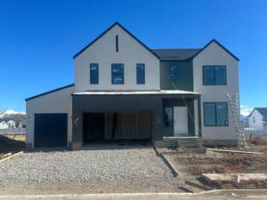 View of front of home featuring a garage