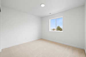 Unfurnished room with carpet flooring