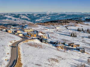 Snowy aerial view with a mountain view