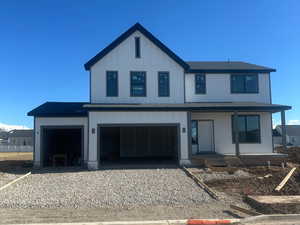 View of front of home featuring a garage