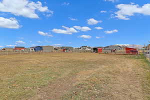 View of yard with an outbuilding