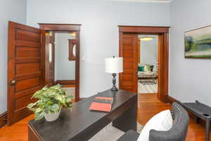 Office area with light hardwood / wood-style flooring