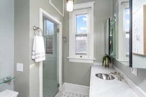 Bathroom featuring vanity and walk in shower