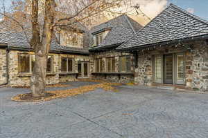 Back house at dusk with french doors