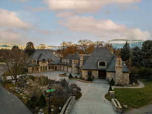 French country inspired facade with a garage