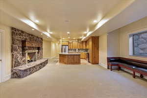 Carpeted living room featuring a fireplace