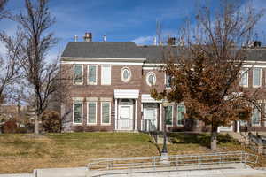 View of front of house with a front yard