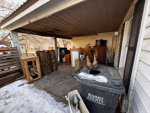 View of patio / terrace featuring grilling area and a carport