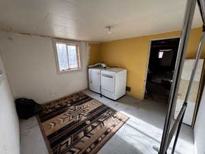 Washroom with washer and clothes dryer