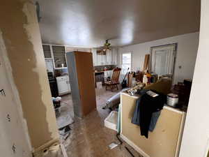 Miscellaneous room featuring tile patterned floors and ceiling fan