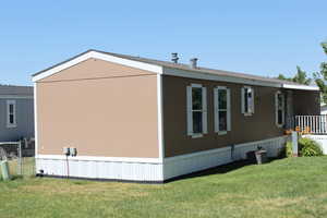 View of home's exterior with a lawn