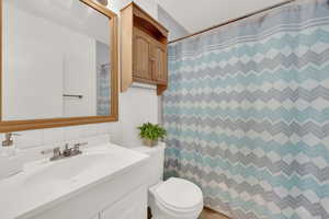 Bathroom with vanity and toilet