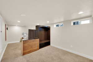 Carpeted bedroom featuring a textured ceiling