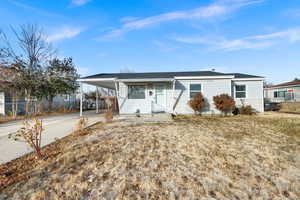 Ranch-style home featuring a carport