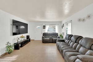 Living room featuring light tile patterned floors