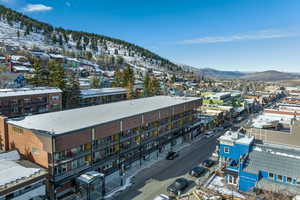 Snowy aerial view with a mountain view