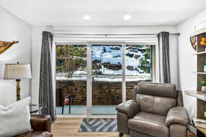 Sitting room featuring light hardwood / wood-style floors