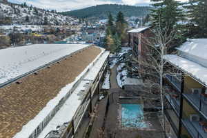 Snowy aerial view with a mountain view