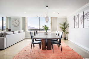 Dining area featuring an inviting chandelier and ornamental molding