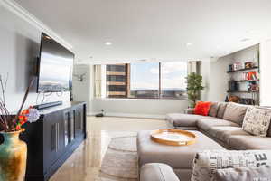 Living room featuring crown molding