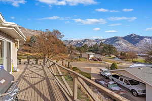 Balcony featuring a mountain view and area for grilling