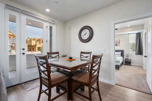 Dining space with hardwood / wood-style floors