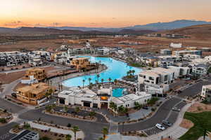 Aerial view at dusk featuring a mountain view