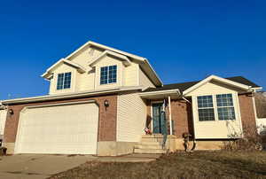 View of front of home featuring a garage