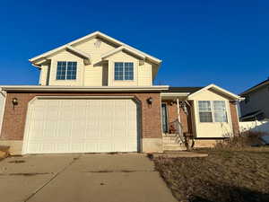 View of front of property with a garage