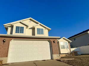 View of front of property with a garage