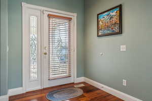 Foyer entrance featuring hardwood / wood-style floors