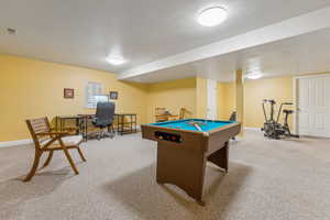 Game room featuring carpet and billiards