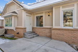 Entrance to property featuring a patio area