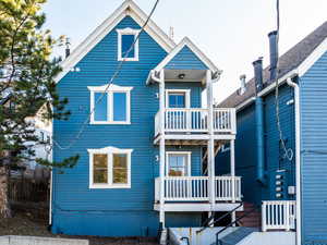 Rear view of house with a balcony