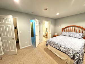 Carpeted bedroom with ensuite bath