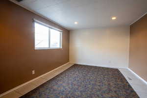 Empty room with tile patterned flooring