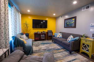 Living room featuring a textured ceiling