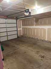 Garage featuring a garage door opener