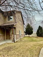 View of property exterior featuring a yard