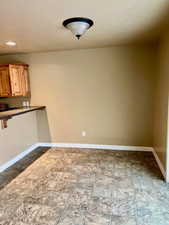 dining area featuring a textured ceiling