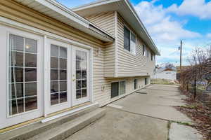 View of side of home with a patio area