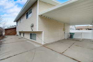 View of side of property featuring a carport