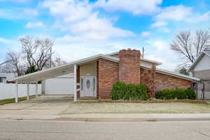 View of front of home with a carport