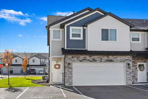 View of front facade featuring a garage