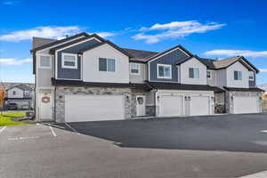 View of property featuring a garage