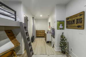 Corridor with light wood-type flooring