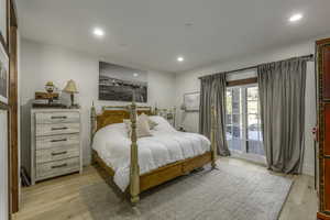 Bedroom featuring access to outside and light hardwood / wood-style floors