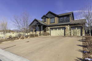 Craftsman-style house featuring a garage