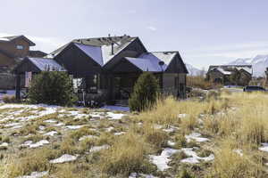 Rear view of house featuring a mountain view