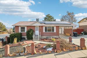 Single story home with solar panels